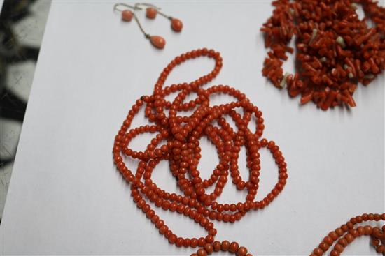 A group of assorted coral jewellery, including necklaces.